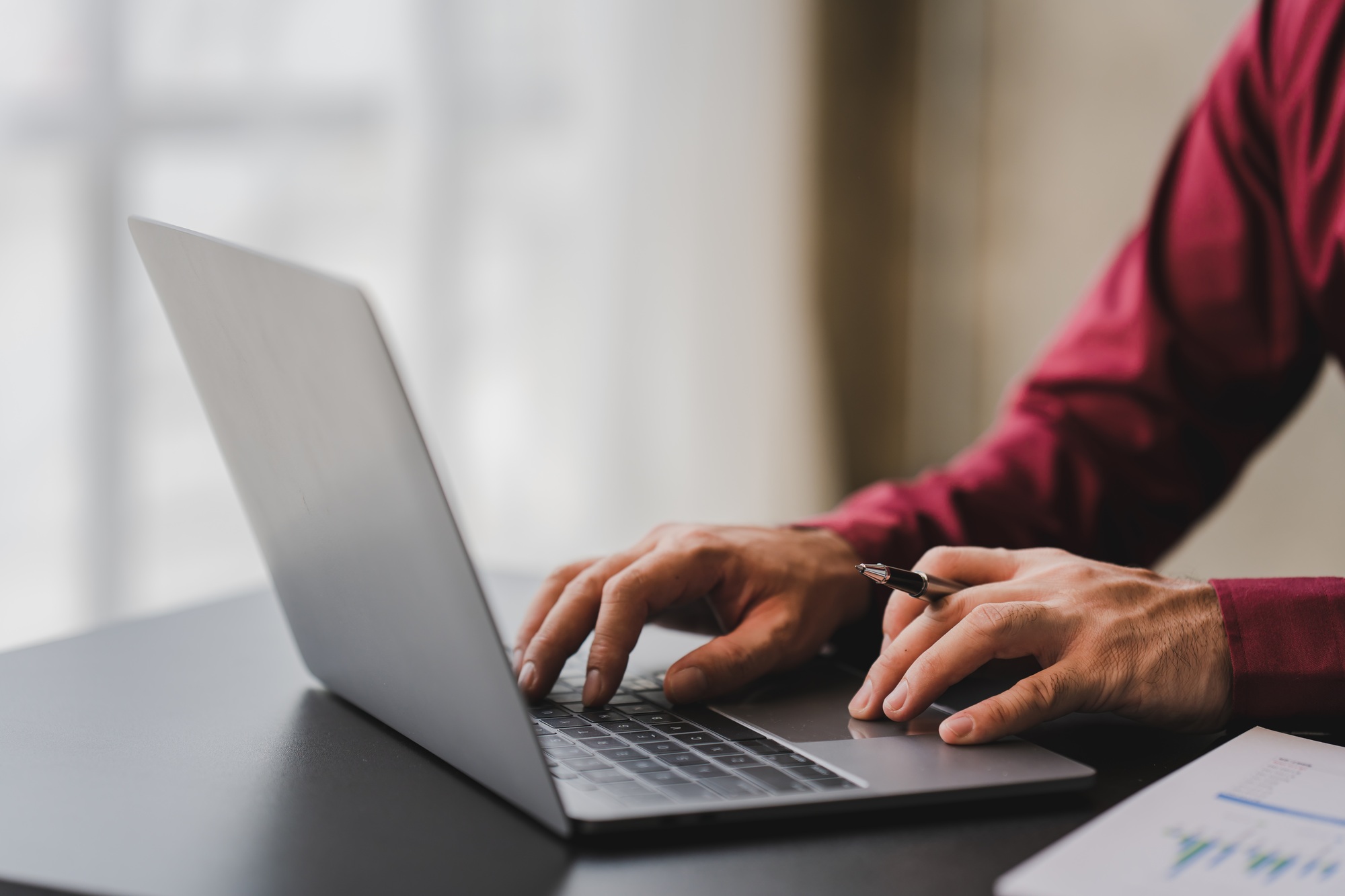 Close-up of printing data check data on laptop